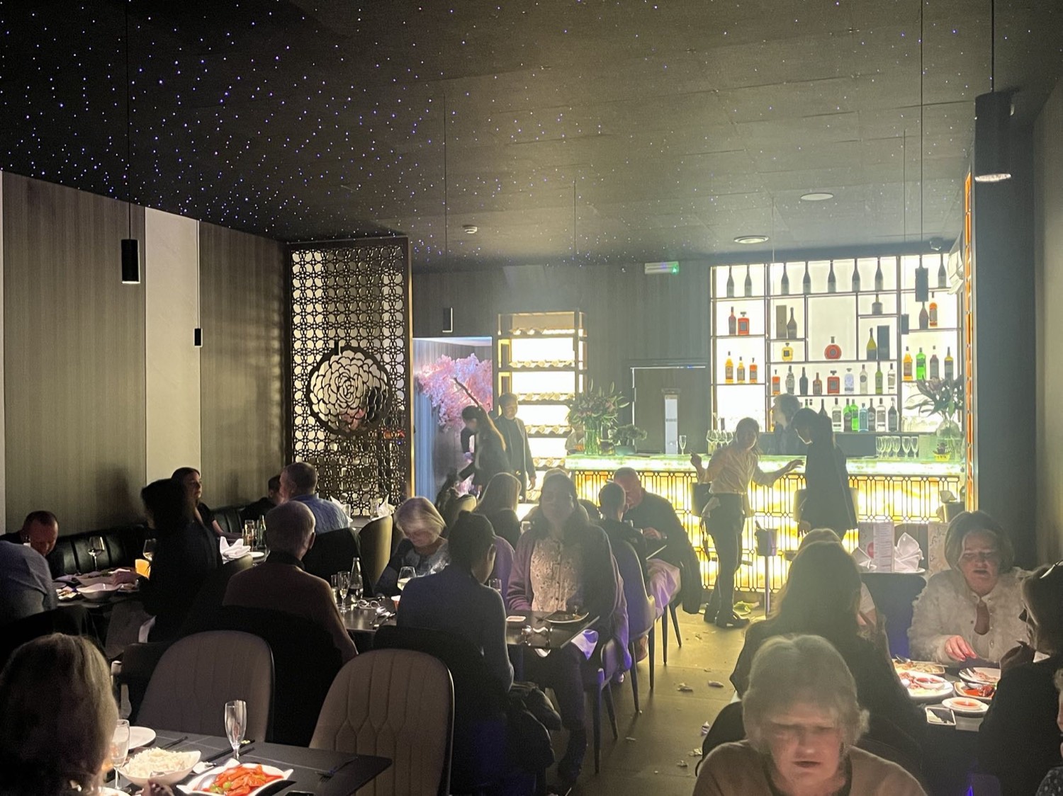 Blossom dining room with blossom tree and glowing bar